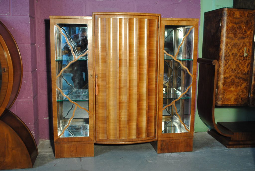Walnut Display Cabinet with Mirrored sides and curved, scalloped door